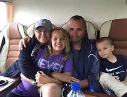 Kirk Minihane, his wife, Christine Ann McTigue, and his two children, Cate Minihane and Harrison Minihane. Photo credit: Google photos. 