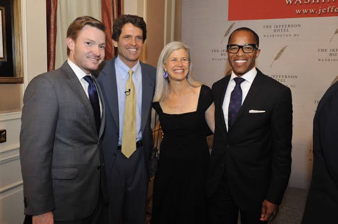 Nick Schmit and his partner, Jonathan Capehart, and their close friends/acqu.