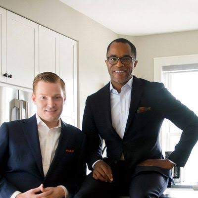 Image - Nick Schmit and his husband, Jonathan Capehart, in a loved-up picture. 