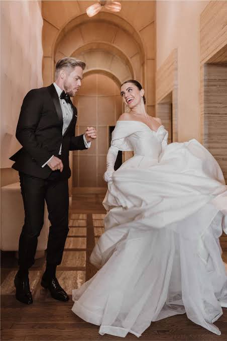 Image - Hayley Erbert and their husband, Derek Hough, on their wedding day. 