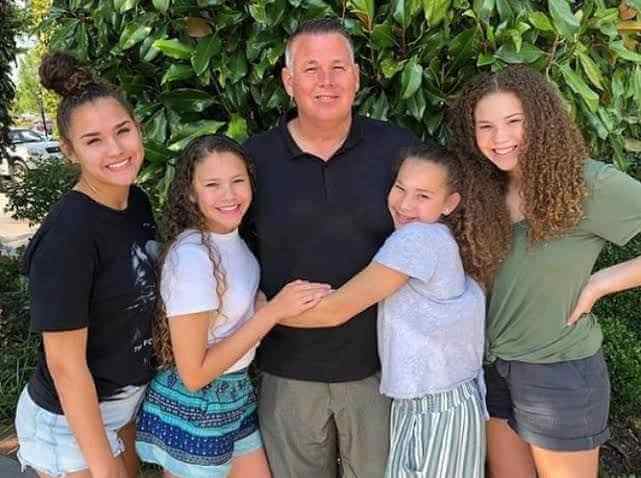 Image - Young Sierra Haschak with her dad, John, and three sisters, Madison, Gracie, and Olivia. 