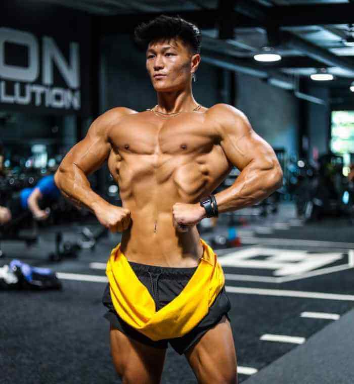 Image - Jeremy Park flexing his upper body after a workout session at the gym. 